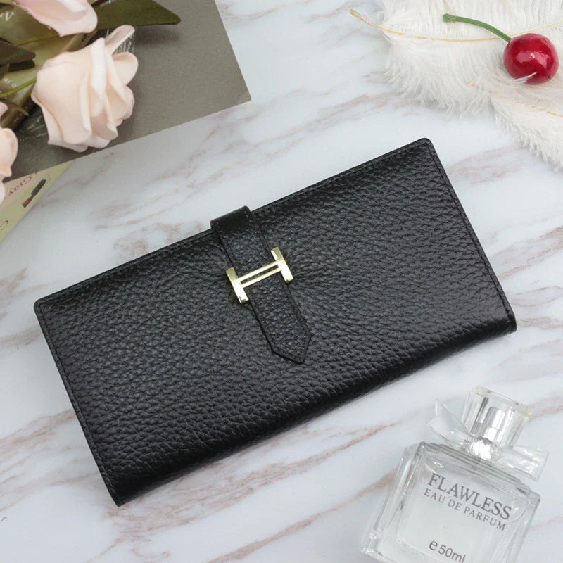 A stylish and practical long wallet made from premium leather, featuring a convenient drawstring closure to keep your essentials organised and secure.