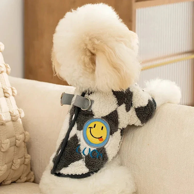A stylish checkered fleece coat for small and medium-sized dogs, providing warmth and comfort during the chilly British autumn and winter seasons.