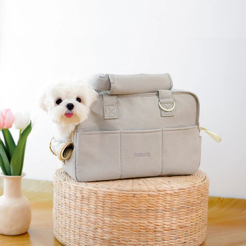 Portable One-Shoulder Pet Carrier Bag made of soft, breathable cotton for comfortable pet travel in the UK