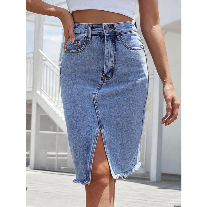 High-waist denim midi skirt with split hem and zipper closure, made from a comfortable cotton-polyester blend for a flattering, structured fit.