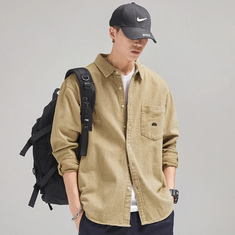 A relaxed, loose-fitting men's shirt in a retro-inspired design, crafted from premium cotton for exceptional comfort and style.