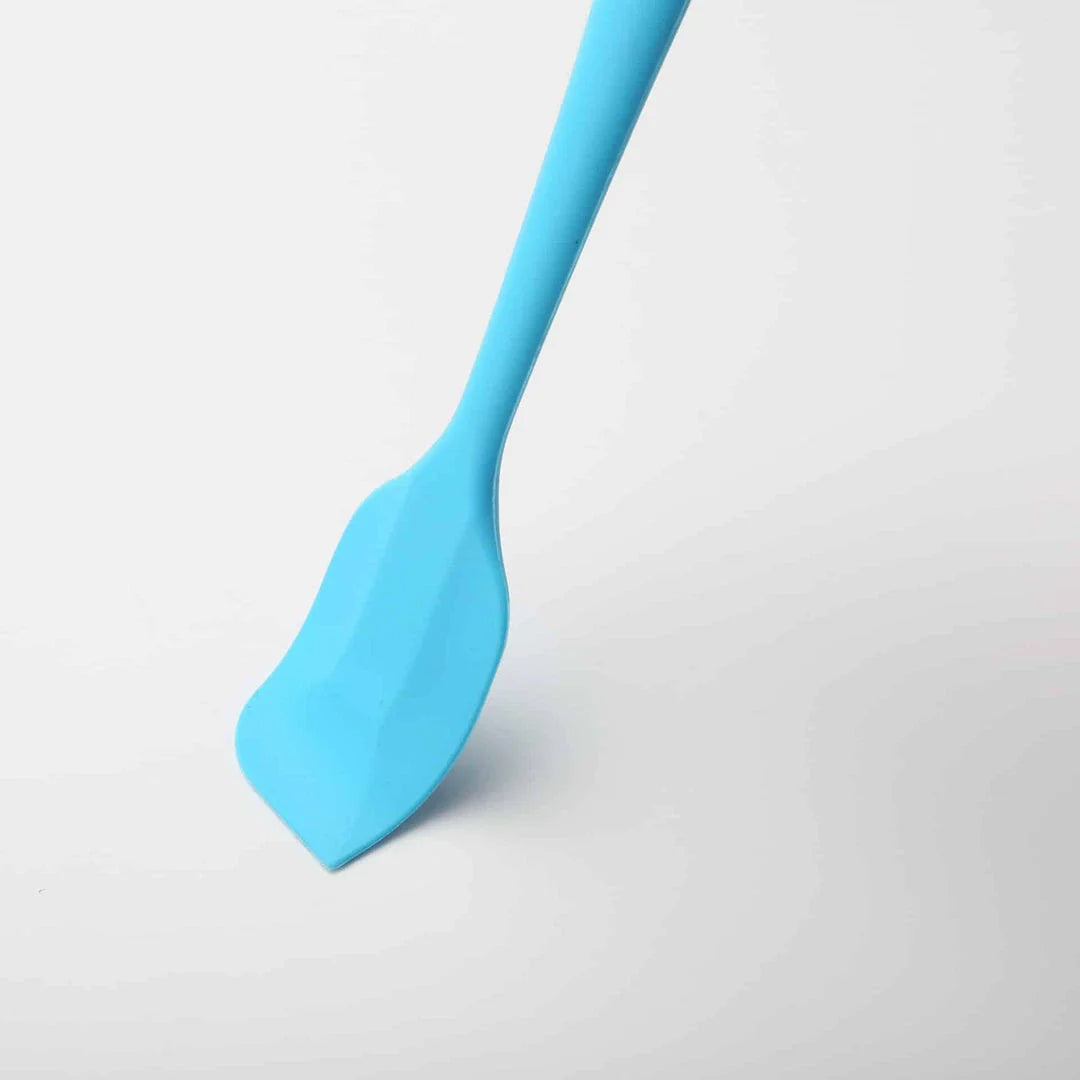 Versatile non-stick silicone cooking spatula in various colours, perfect for flipping, stirring, and serving a wide range of dishes
