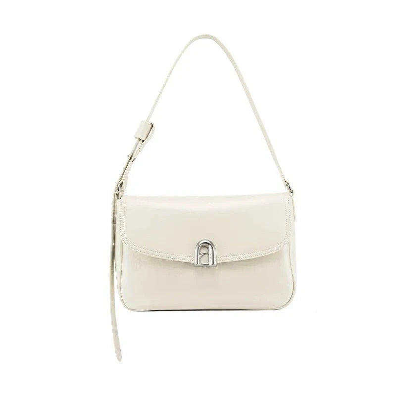 Stylish leather shoulder and crossbody bag in burgundy colour, with a square silhouette and sleek design