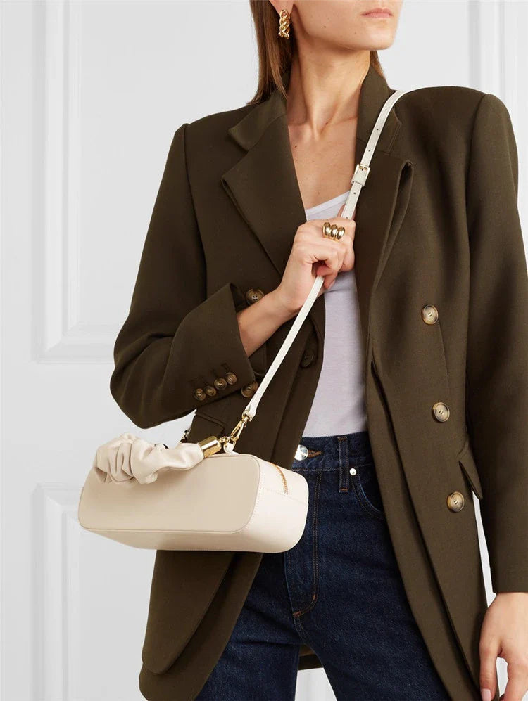 Sophisticated long shoulder diagonal bag with a sleek horizontal square design, made of durable synthetic leather and featuring a single shoulder strap for hands-free convenience.