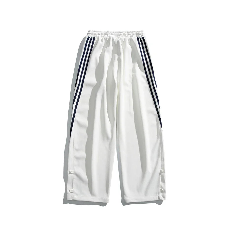 Stylish striped sports trousers in a relaxed, mid-waist design for versatile leisure and athletic wear