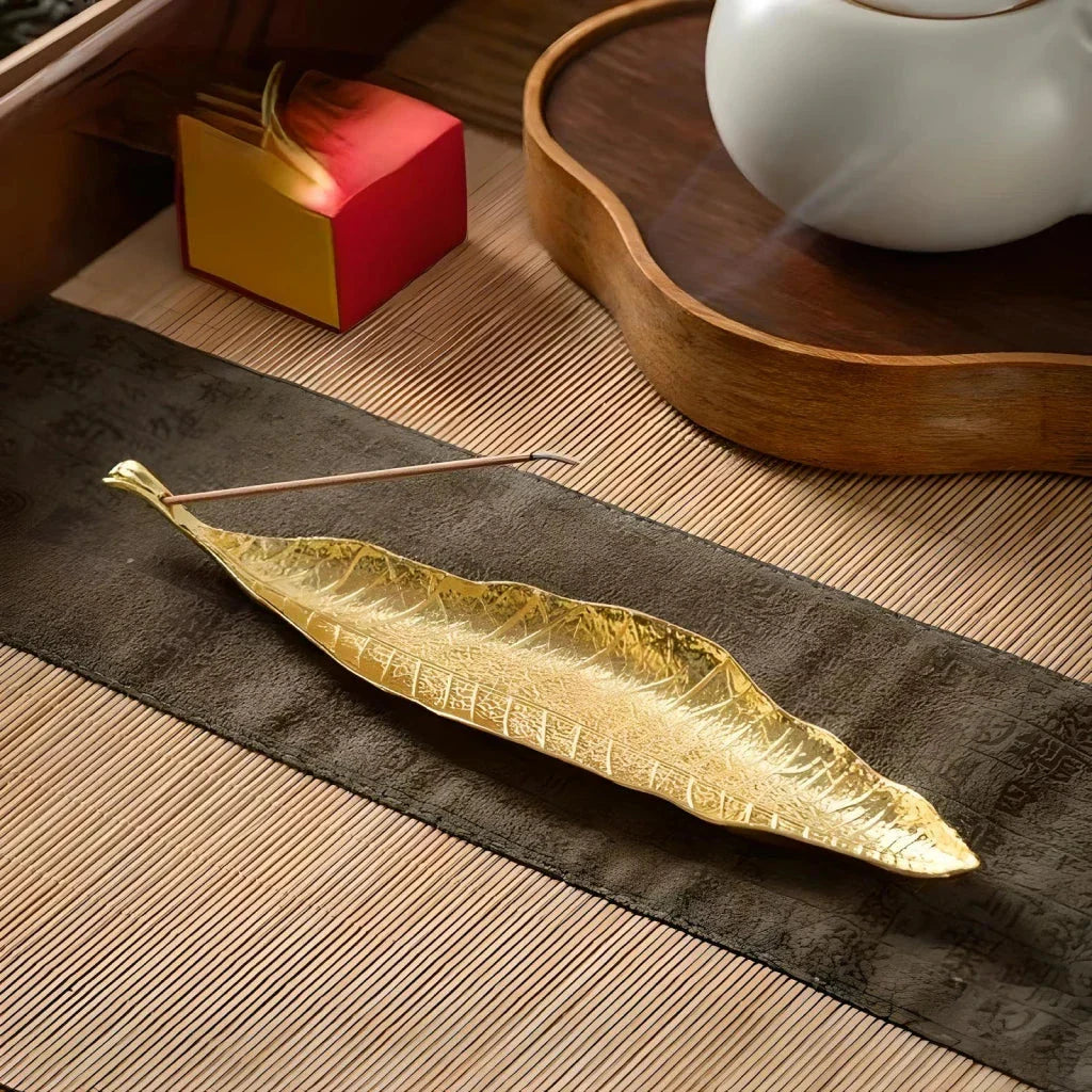 Elegantly crafted copper alloy incense holder with Bodhi leaf design, perfect for meditation and home decor