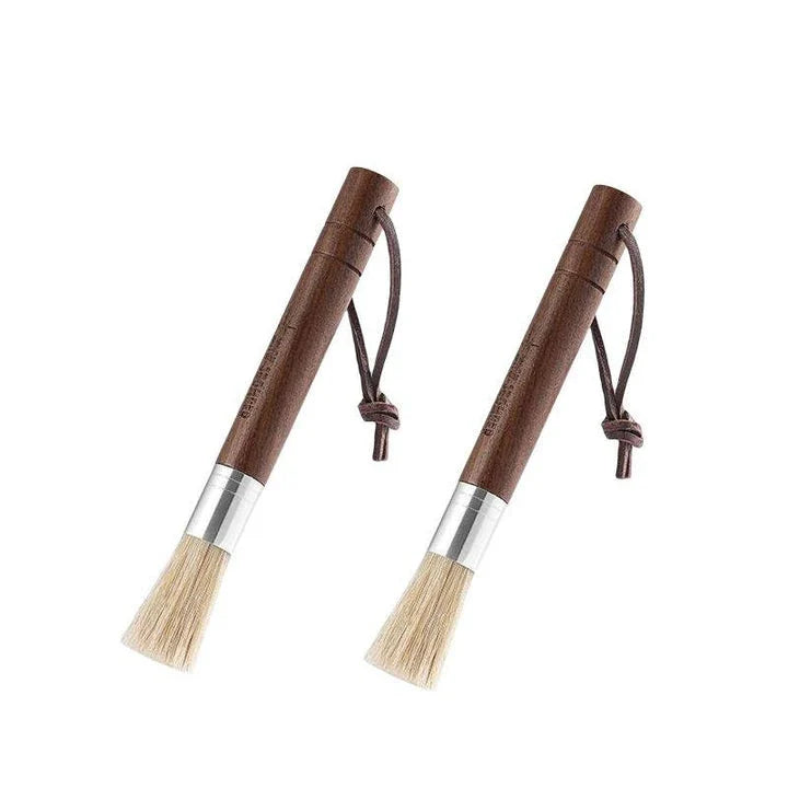 Premium espresso brush with natural fibre bristles and wooden handle, used to clean coffee grinders and equipment