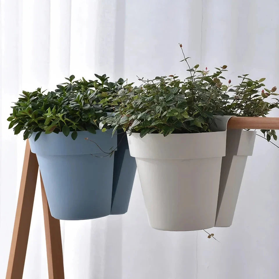 Stylish double-sided hanging rail planter in white, designed to display flowers and plants on both sides of a railing or surface