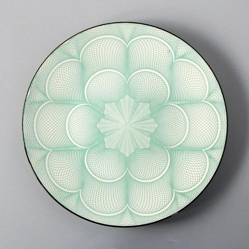 Elegant ceramic plates with vibrant, whimsical prints in a variety of enchanting designs