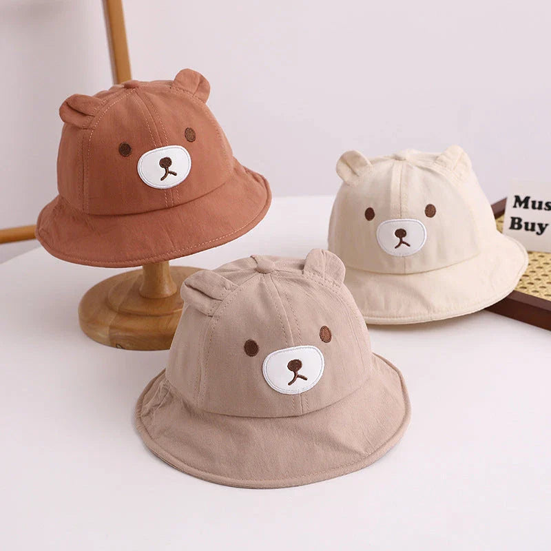 Adorable kids' bear-themed panama bucket hat with soft, breathable fabric and adjustable fit for sun protection and style