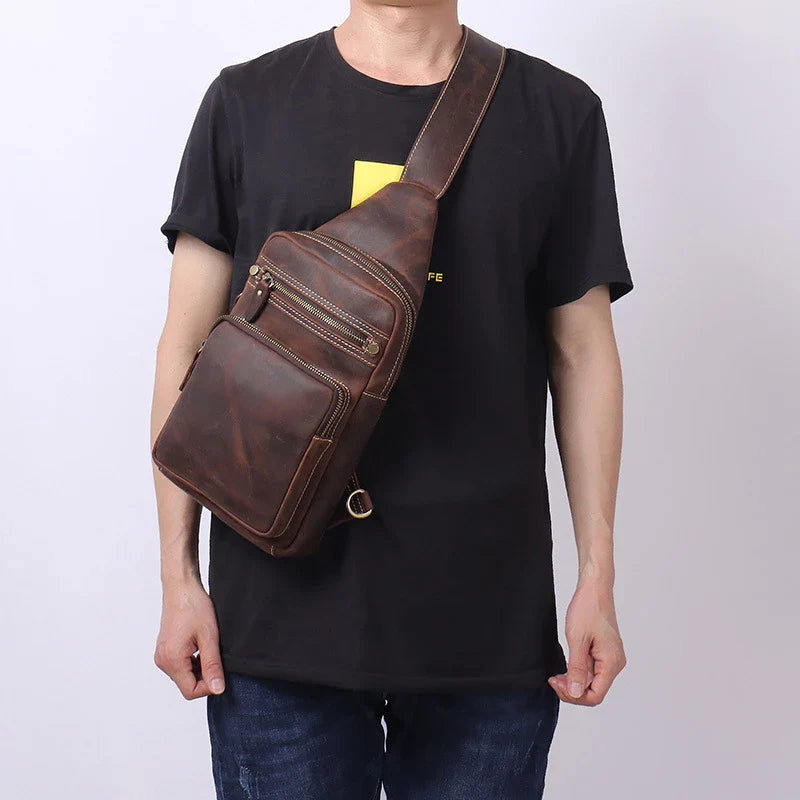 Vintage-inspired genuine leather briefcase with multiple compartments and secure zipper closure, ideal for modern commuters