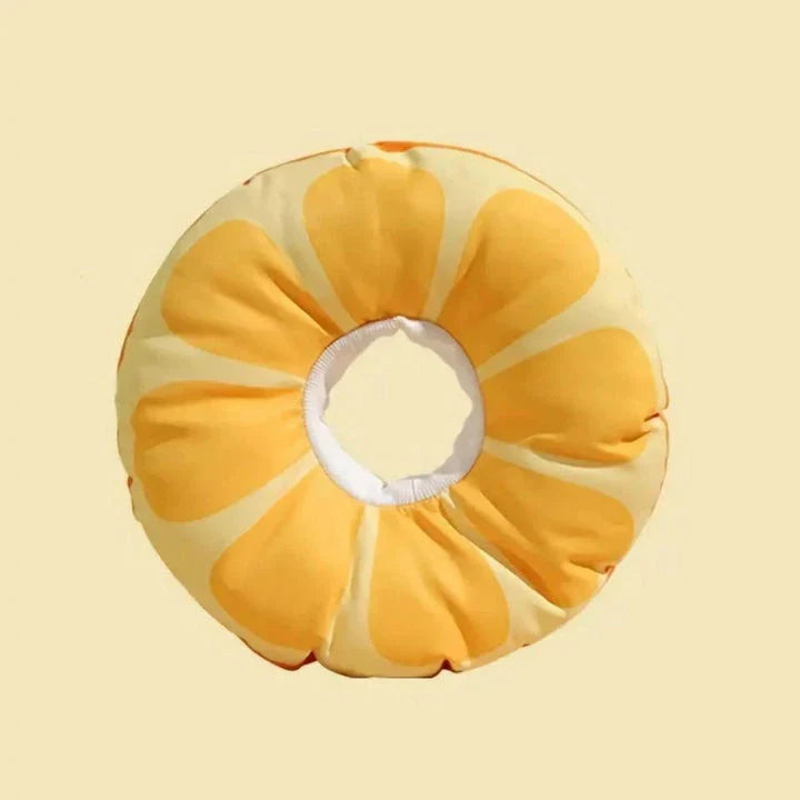 A vibrant orange fruit-shaped recovery collar for cats, designed to protect and comfort your pet during their healing process.