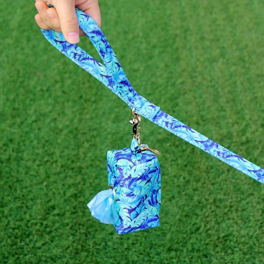Stylish floral dog walking bag with multiple compartments for treats, snacks, waste bags, and keys