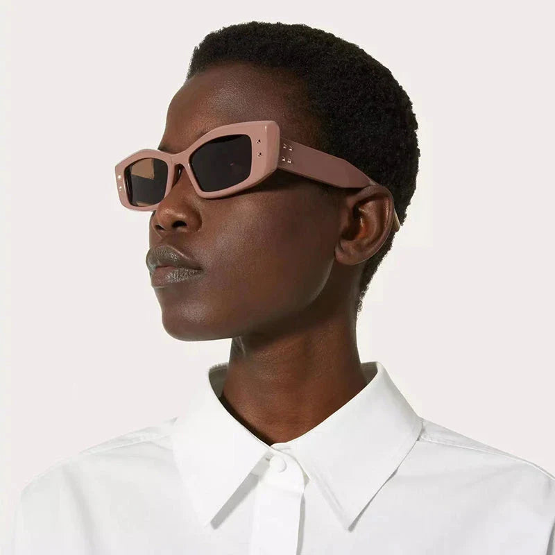 Retro cat eye sunglasses with rivet details, offering a stylish and protective eyewear solution.