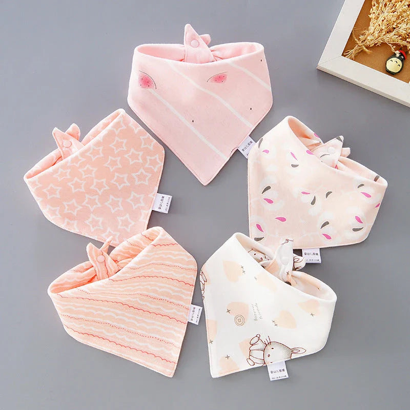 Stylish cotton baby bandana bibs in various fashionable prints, designed to keep your little one dry and comfortable.