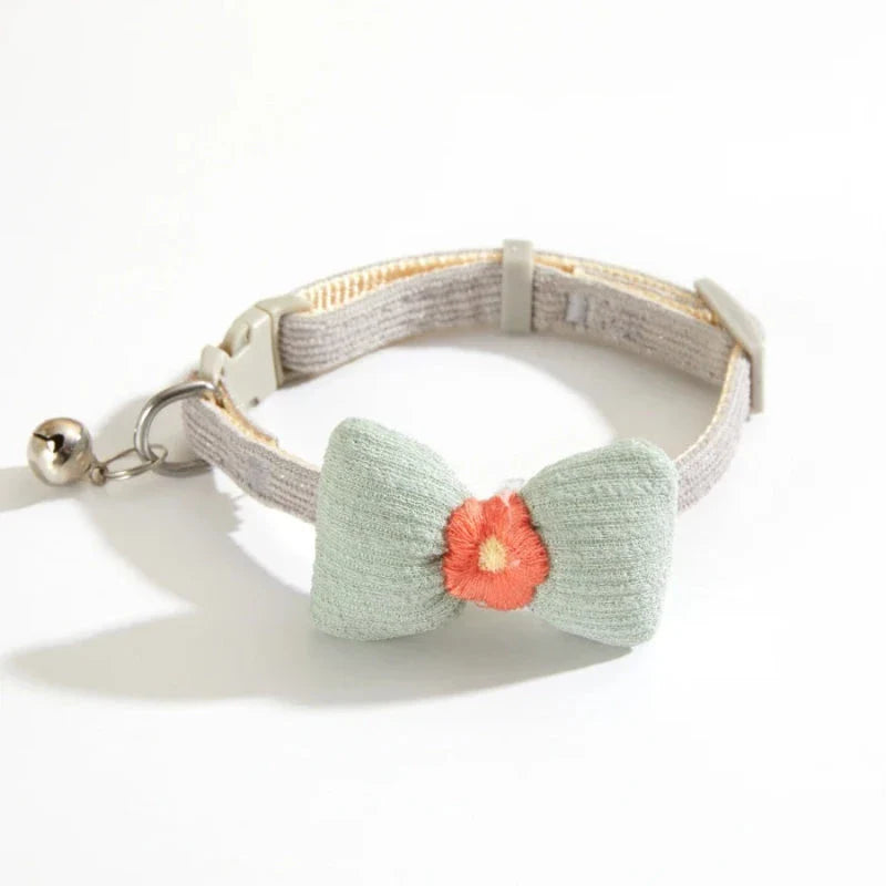 Stylish checkered pet collar with elegant butterfly knot decoration, perfect for dressing up cats and dogs