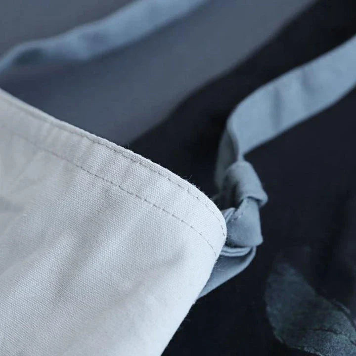 Premium cotton barista apron with a beautiful coconut leaf print design, perfect for coffee shop staff