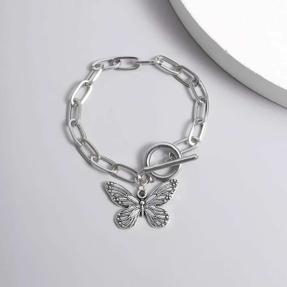 Silver butterfly pendant bracelet with a delicate chain and charming bowknot design