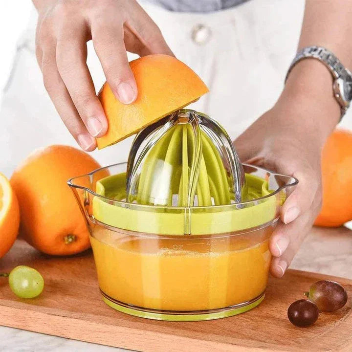 A manual citrus juicer with a built-in measuring cup, grater, and egg separator for versatile kitchen tasks