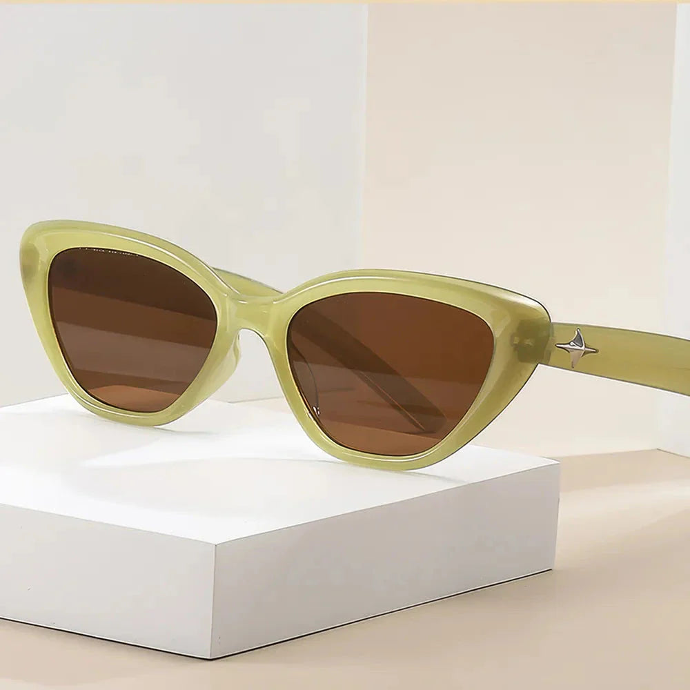 Classic cat-eye sunglasses with rice nail detail, offering UV protection and gradient lenses for a timeless, sophisticated look.