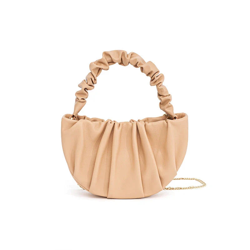 Luxurious sheepskin pleated crossbody bag in various colours, featuring a chic and contemporary design perfect for any occasion.