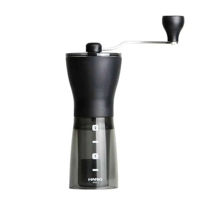 Stylish powder coffee grinder in black and red, with a manual grinding mechanism for consistent and freshly ground coffee.