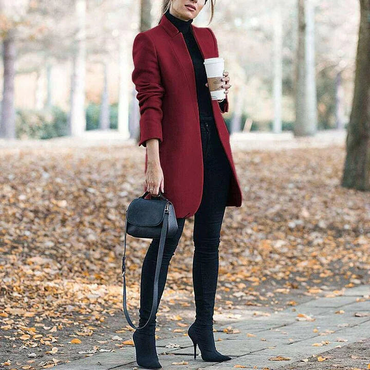 Premium British woollen coat with stand collar, featuring a sleek, slim-fit silhouette and subtle stitching details