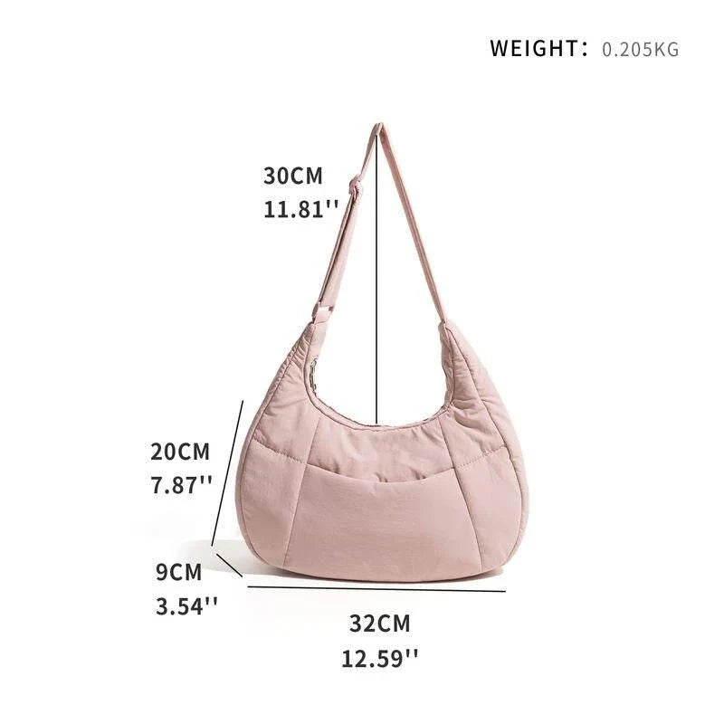 Chic Half Moon Puffer Shoulder Bag in a stylish pink colour, featuring a unique design and practical features for the modern woman.