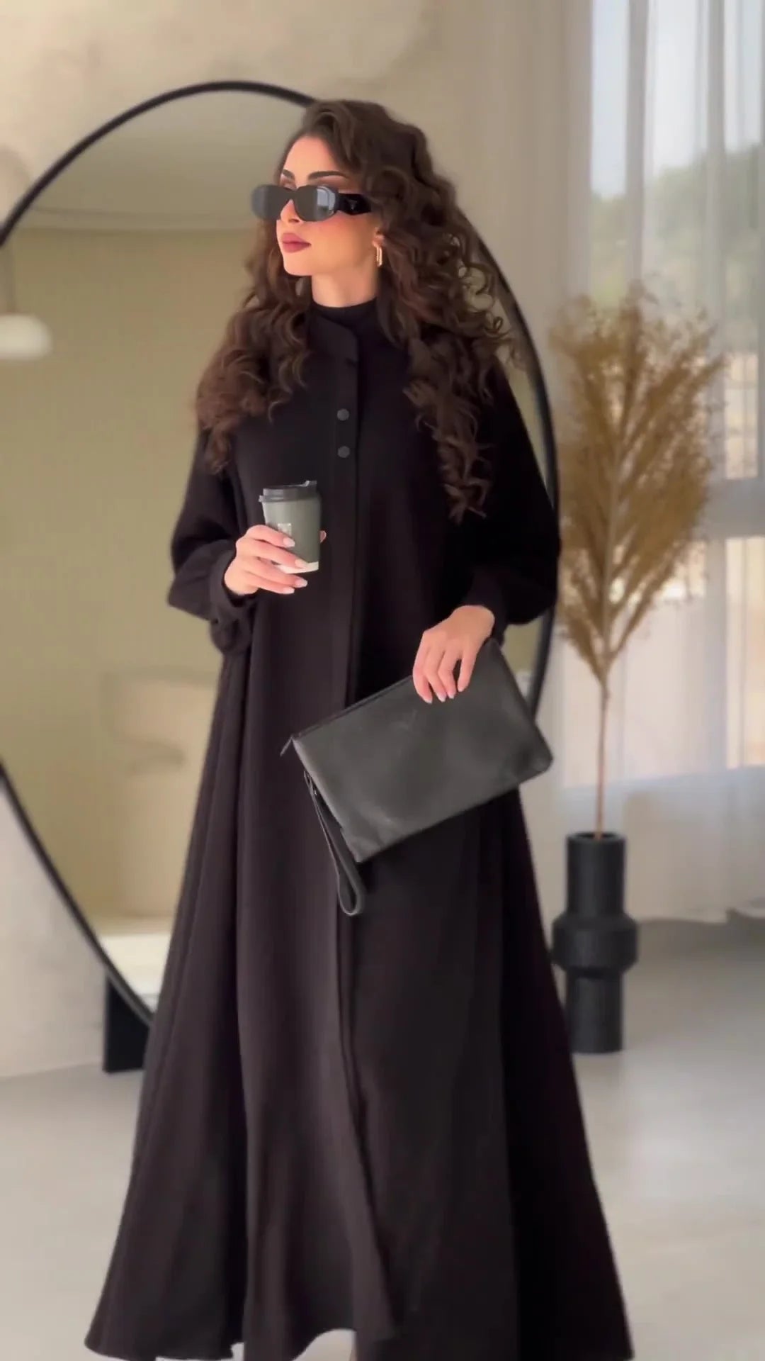 Premium black commuter swing skirt dress with long sleeves and an elegant A-line silhouette