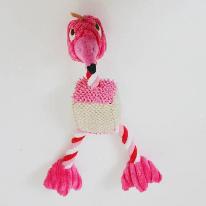 A plush, bird-shaped dog toy in a pink colour. It is designed to encourage chewing and snuggling behaviour in dogs.