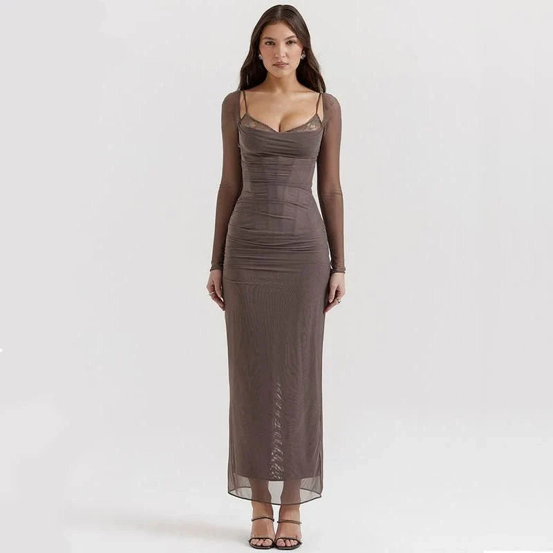 Elegant sheer long sleeve maxi dress in black, featuring a flattering H-profile silhouette and full-length design for a sophisticated evening look.