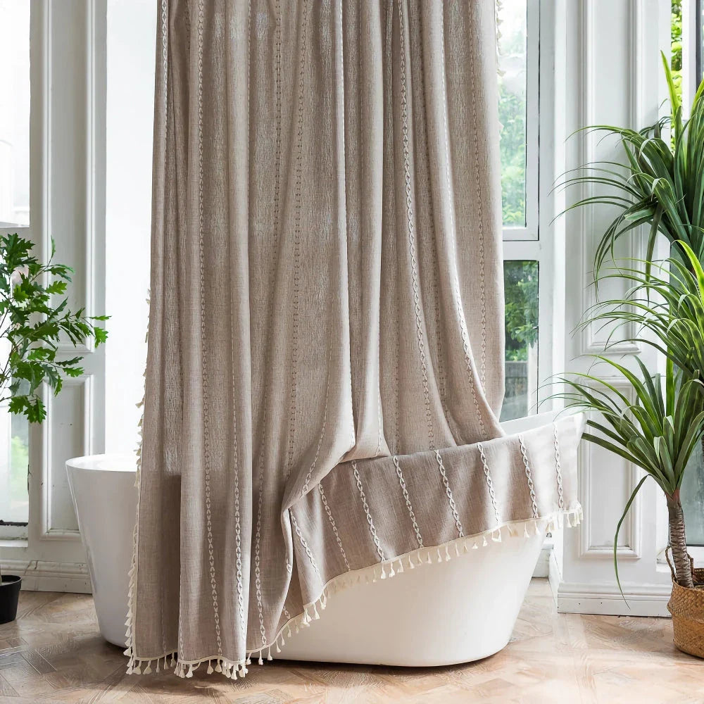 Premium bohemian tassel shower curtain with unique stitching design, waterproof coating, and durable linen blend material for a relaxing bathroom oasis