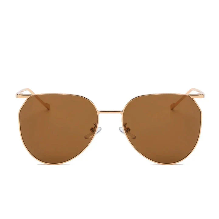 Elegant oval-shaped sunglasses with gradient lenses and alloy frames, offering timeless British style and UV protection.