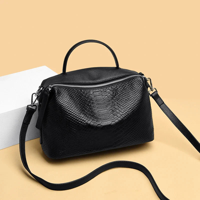 Premium first-layer cowhide leather messenger bag with adjustable strap and multiple compartments for organised storage
