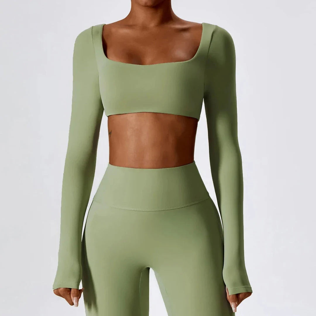 Stylish long sleeve crop top yoga shirt in green, designed for comfort and performance during workouts