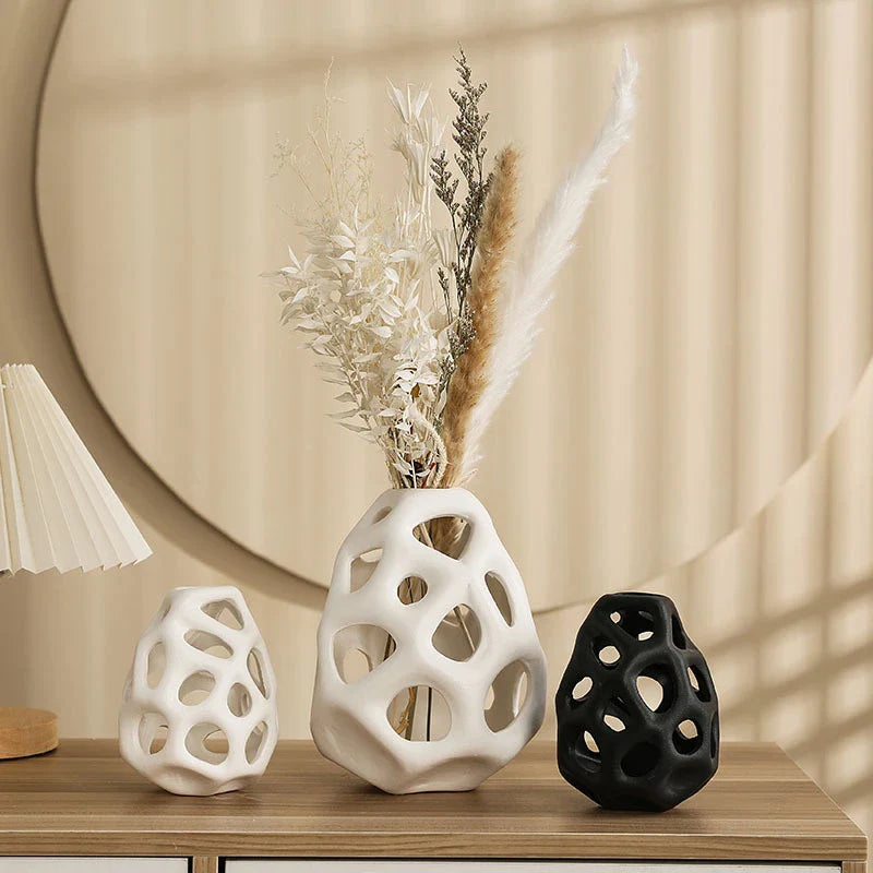 Stylish ceramic decorative balls in geometric design, available in white and black, small and large sizes, for modern home decor