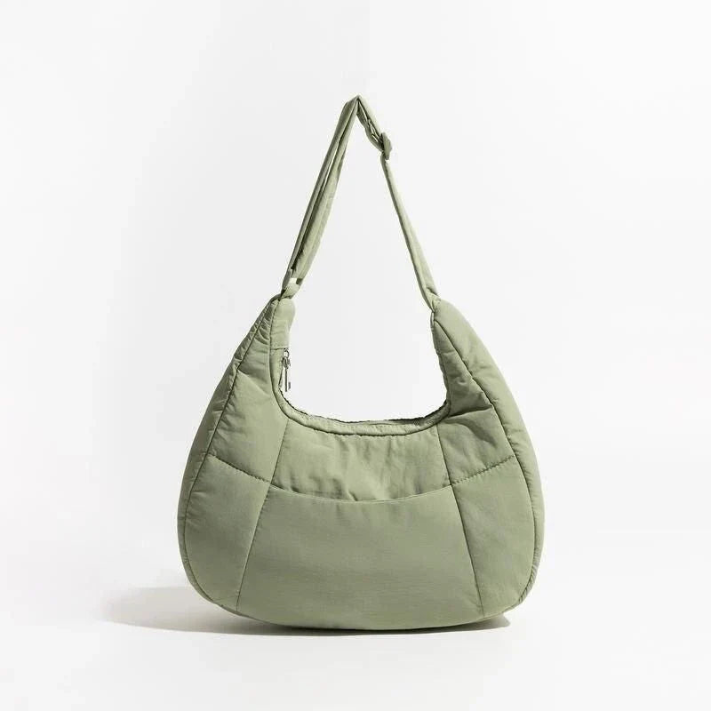 Chic Half Moon Puffer Shoulder Bag in a stylish pink colour, featuring a unique design and practical features for the modern woman.