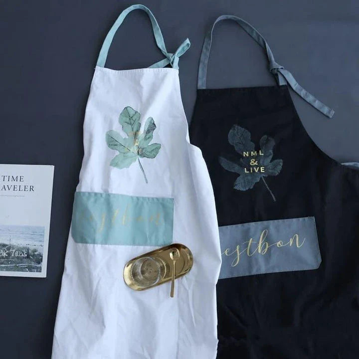 Premium cotton barista apron with a beautiful coconut leaf print design, perfect for coffee shop staff