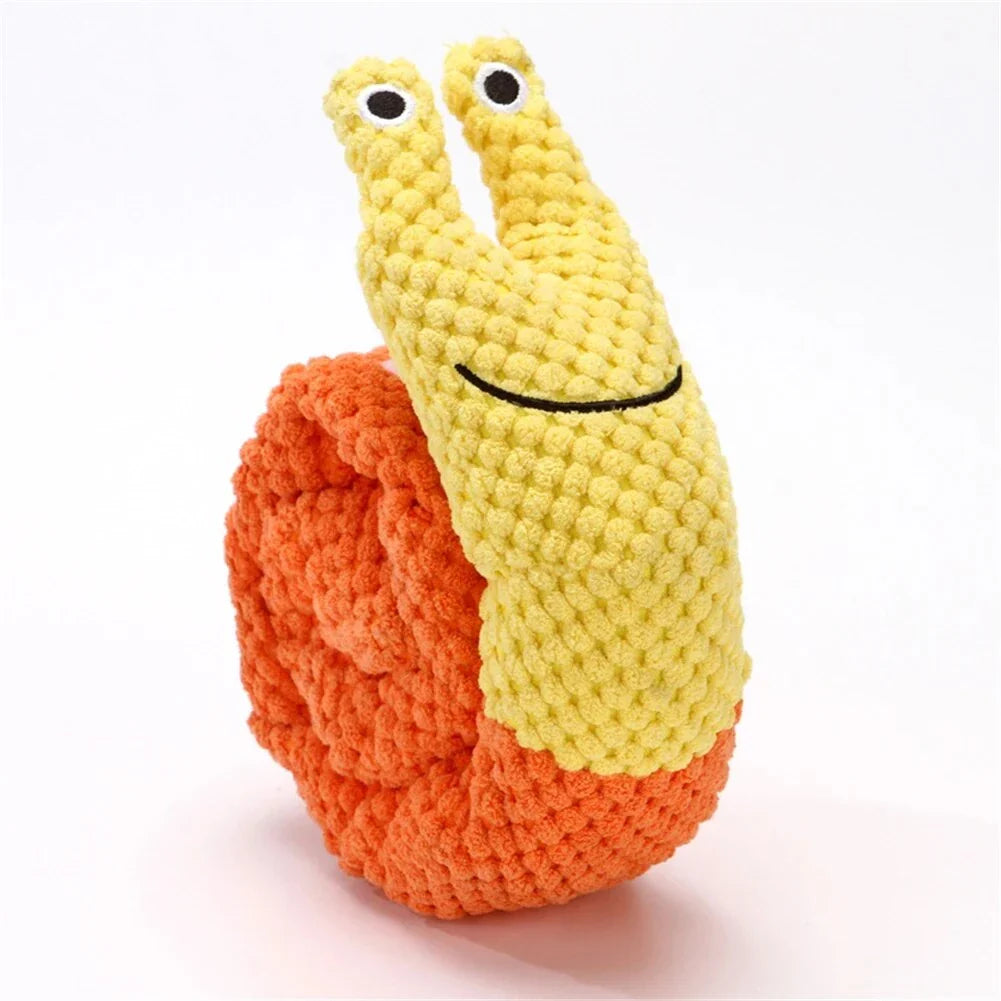 A plush snail-shaped snuffle mat toy with hidden treat pockets, designed to stimulate a dog's natural foraging instincts.