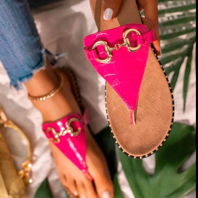Stylish and comfortable women's leather sandals with a sleek metal buckle, perfect for summer