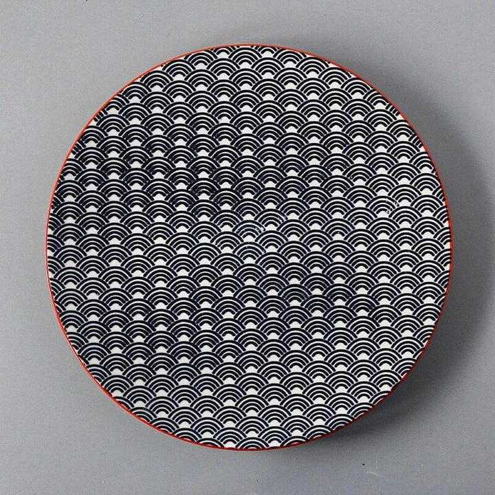 Elegant ceramic plates with vibrant, whimsical prints in a variety of enchanting designs
