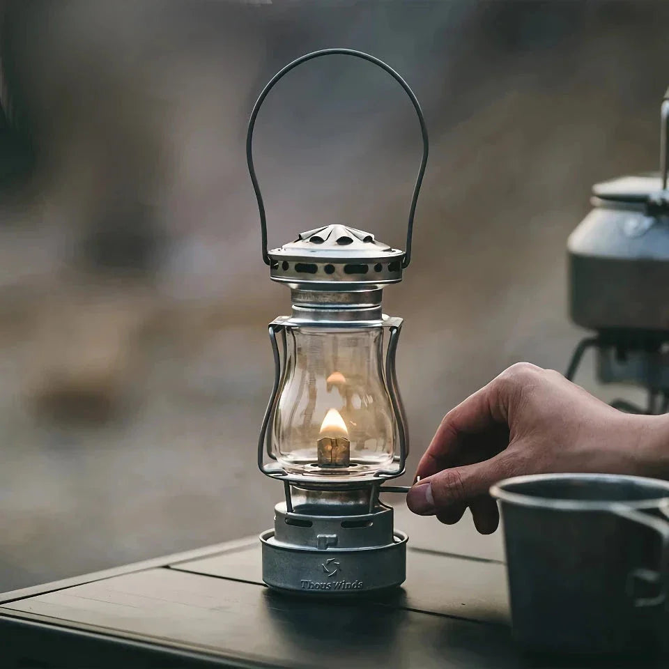 Classic vintage-inspired kerosene camping lamp with stainless steel construction and automatic ignition for reliable outdoor lighting