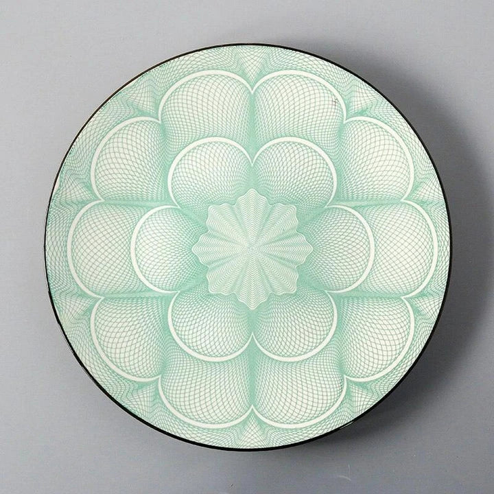 Elegant ceramic plates with vibrant, whimsical prints in a variety of enchanting designs
