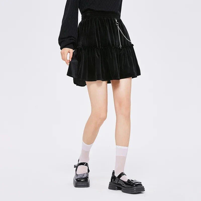 A stylish and playful above-knee mini skirt with intricate chain detailing, offering a versatile and fashionable addition to any wardrobe.