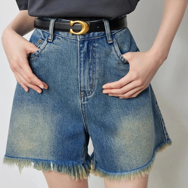 Vintage-inspired high-waisted denim shorts with tassel detailing for women