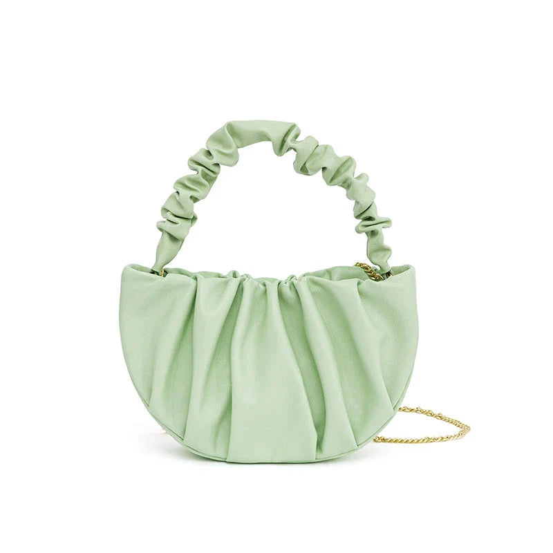 Luxurious sheepskin pleated crossbody bag in various colours, featuring a chic and contemporary design perfect for any occasion.