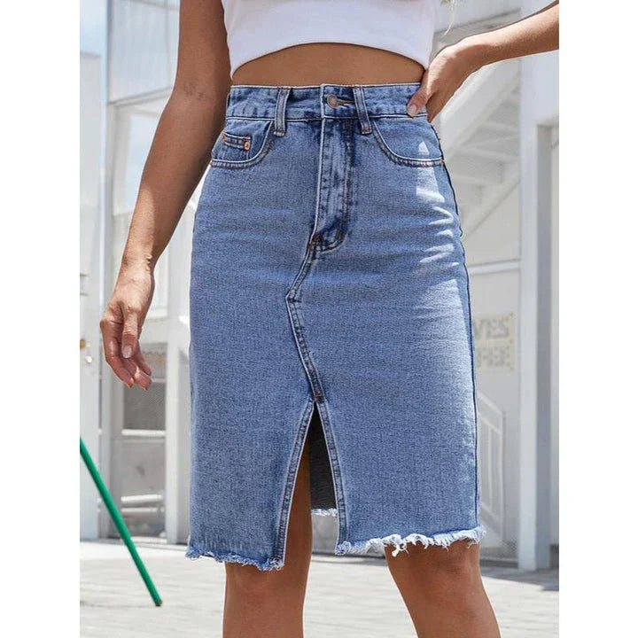 High-waist denim midi skirt with split hem and zipper closure, made from a comfortable cotton-polyester blend for a flattering, structured fit.