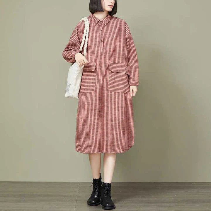 Plus-size women's dress with a striped pattern, asymmetric skirt, and long loose sleeves
