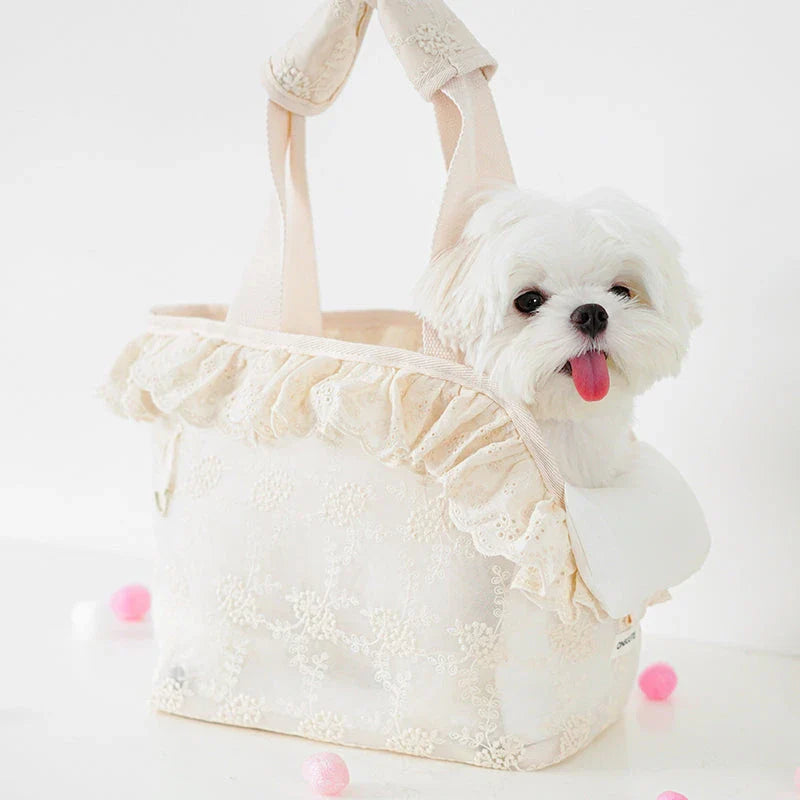 Stylish and comfortable pet carrier bag for small dogs in a floral lace design, providing breathable and cushioned support for your furry friend