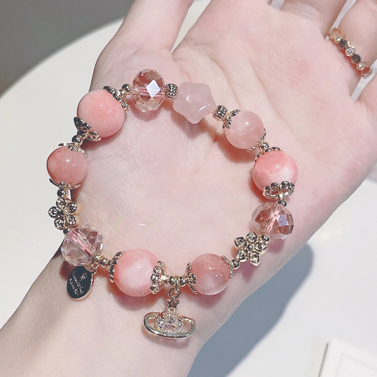 Stylish cream agate crystal bracelet with captivating Star of Peach design, available in S and M sizes for fashion-conscious British women